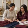 Women discussing custom suit fabrics at a Ludhiana boutique