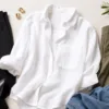 White linen shirt styled with black, olive and denim separates