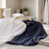 Women's linen shirt care with steamer, hanger and pressing cloth