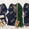 Navy blue suit styled with ivory, green and silver accessories